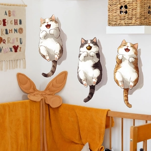 Three cute cartoon cat wall decals in a warm home bedroom setting for wall decoration