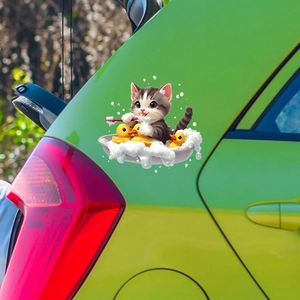 Cute cartoon bathing cat sticker with yellow ducks on a bright green car trunk