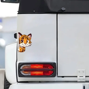 Cute cartoon tiger peeking car window sticker made of durable orange PVC material