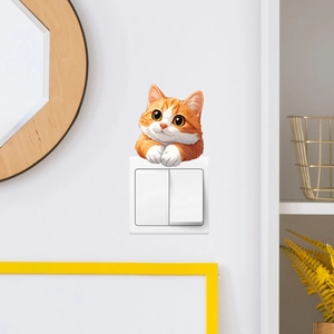 Cute ginger cat wall sticker peering over a light switch for home interior decor