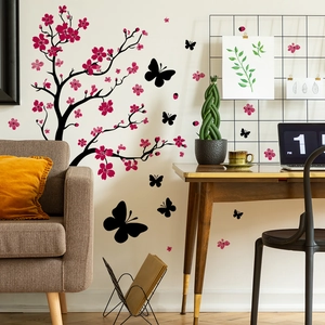 Sticker mural avec branches de cerisier roses et papillons noirs pour la décoration
