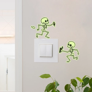 Luminous electric skull wall sticker for light switches in glow green PVC design