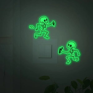 Luminous electric shock skeleton wall stickers glowing green on a light switch panel