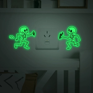 Glow-in-the-dark skeleton light switch wall stickers with creative neon green fluorescent effect