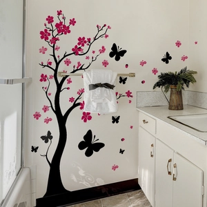 Sticker mural fleurs de cerisier roses avec branches noires et papillons pour chambre