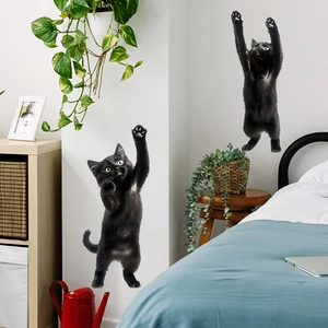 Charming black cat wall decals featuring two kittens climbing on a white home wall