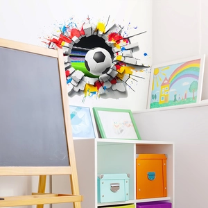 3D football wall sticker breaking through a brick wall with colorful paint splatters for kids
