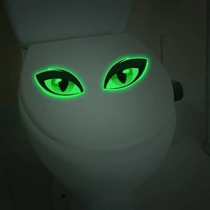 Stickers yeux de monstre vert lumineux pour salle de bain brillent dans le noir