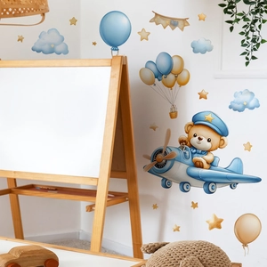 Adesivo murale orsetto pilota su aereo con palloncini blu e stelle dorate per bimbi