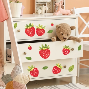 Cute cartoon strawberry wall stickers applied to a white wooden drawer for home decoration