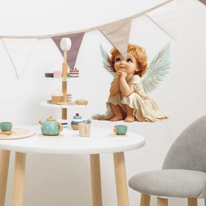 Cute angel wing wall sticker featuring a cherub with gold hair for nursery decor