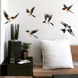 Detail view of 6 colorful flying swallow wall stickers in a modern home living room decor