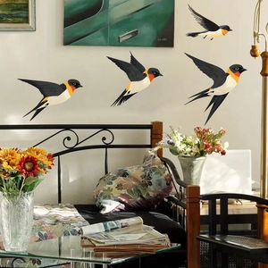 Set of four realistic swallow wall stickers in various flying poses for home decor