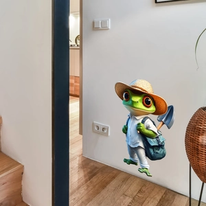 3D cartoon frog traveler wall sticker with hat and backpack on modern white living room wall