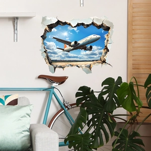 Sticker mural 3D d'avion avec effet de mur brisé montrant un jet dans le ciel bleu
