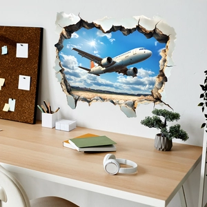 Sticker mural 3D montrant un avion volant à travers un mur brisé vers le ciel bleu clair