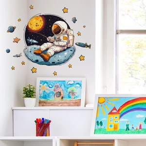 Cartoon astronaut fishing on a grey planet wall sticker set with stars and rockets