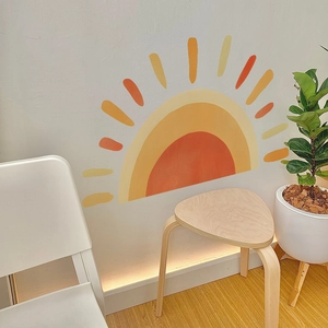 Boho style rainbow sun wall decal in warm orange and yellow for nursery home decor