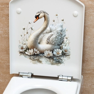 Detail of elegant swan toilet lid sticker with white flowers on a stone tile floor