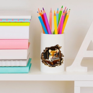 Detail of DIY mouse hole wall sticker on a white pencil holder with colored pencils