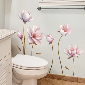 Detailed close-up of pink magnolia floral wall stickers on a clean bathroom wall surface