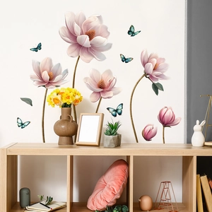 Detailed wall sticker showing pink magnolia flowers and blue butterflies in a living room
