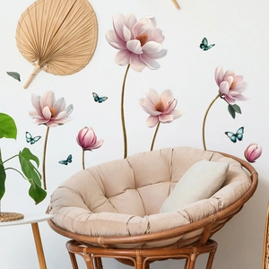 Detailed view of magnolia flower and butterfly wall stickers in a modern living room