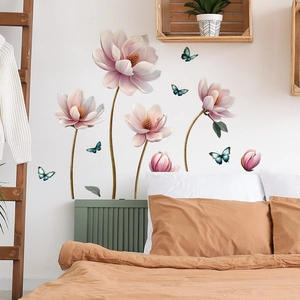 Pink embossed floral wall stickers with blue butterflies in a cozy bedroom setting