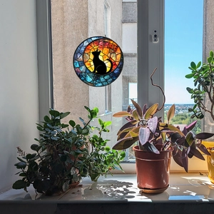 Stained glass style round suncatcher featuring a black cat silhouette and moon for windows