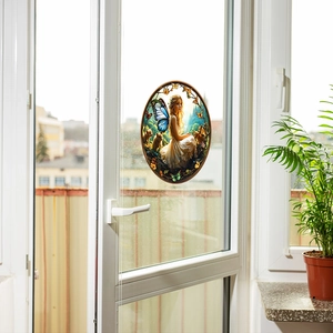 Fairy and butterfly static window decal on a glass window with natural sunlight