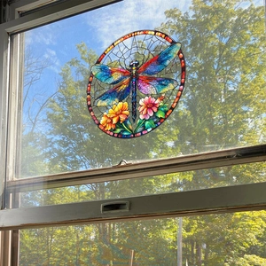 Close-up of a colorful dragonfly stained glass window film showing natural light transmission