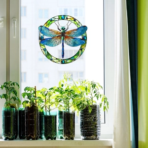 Stained glass dragonfly window decal with vibrant translucent colors and round design