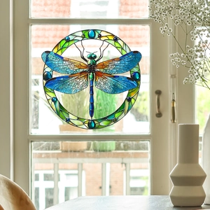 Detail of a stained glass dragonfly window suncatcher with translucent blue wings