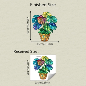 Detail view of tropical monstera plant window sticker with dimensions for home decor