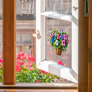 Static cling window film with colorful hanging flower basket design on a white glass frame