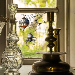 Gothic Halloween spider suncatcher with intricate web and vintage glass window decal