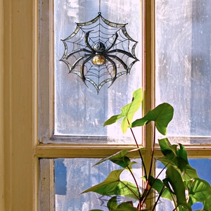 Creative stained glass spider web window suncatcher with translucent amber spider