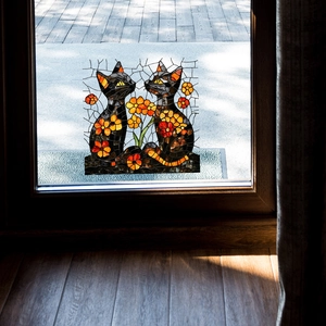 Stained glass style window film featuring black cats and orange flowers for home decor