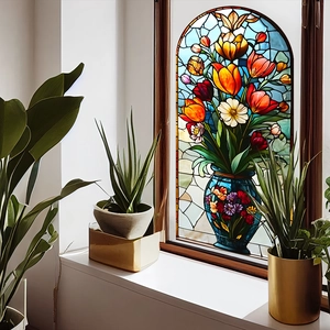 Vibrant tulip flower vase window sticker with stained glass effect on a bright windowsill