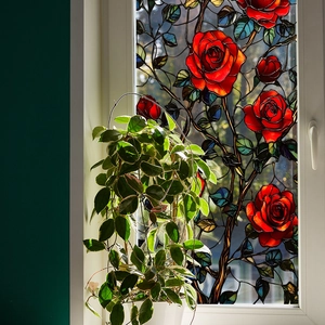 Detailed view of vibrant red rose stained glass window film for home privacy and decoration