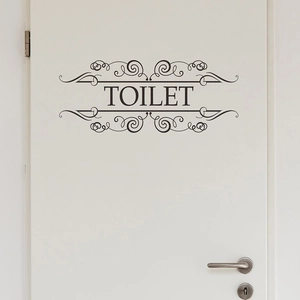 Self-adhesive TOILET door sticker with vintage scroll frame on white wooden door