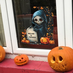 Halloween window clings featuring cute reaper and pumpkin decorations on glass
