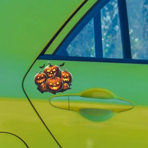 Halloween car stickers with pumpkins and bats on a green car door for holiday decor
