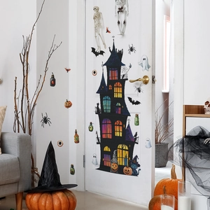 Halloween wall decals set with black castle, bats, and spiders on a white door