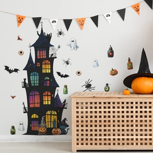 Halloween wall decals featuring a black castle, ghosts, and a cat on a white bedroom wall