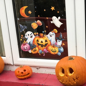 Halloween static window clings featuring cartoon pumpkin, ghost and bats on glass balcony