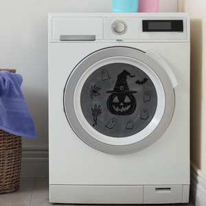 Halloween eyeball pumpkin and ghost static stickers on a white washing machine