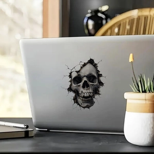 3D realistic skull sticker with cracked effect on silver laptop for office desk decor