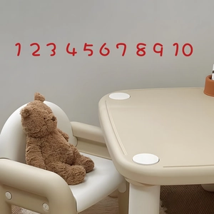 Minimalist kids desk and chair set with rounded safety edges and teddy bear decoration
