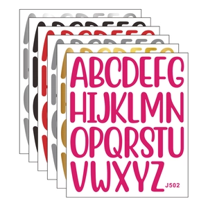 Close-up of DIY colorful alphabet stickers in six colors for scrapbook decoration